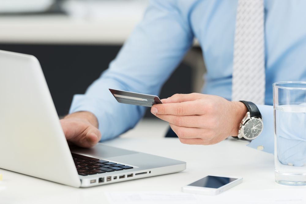 Businessman-doing-online-banking-making
