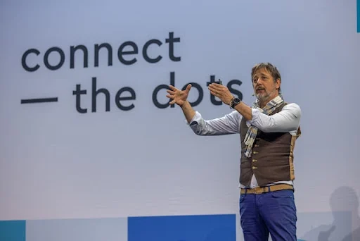 a speaker captivates the audience during a conference presentation.